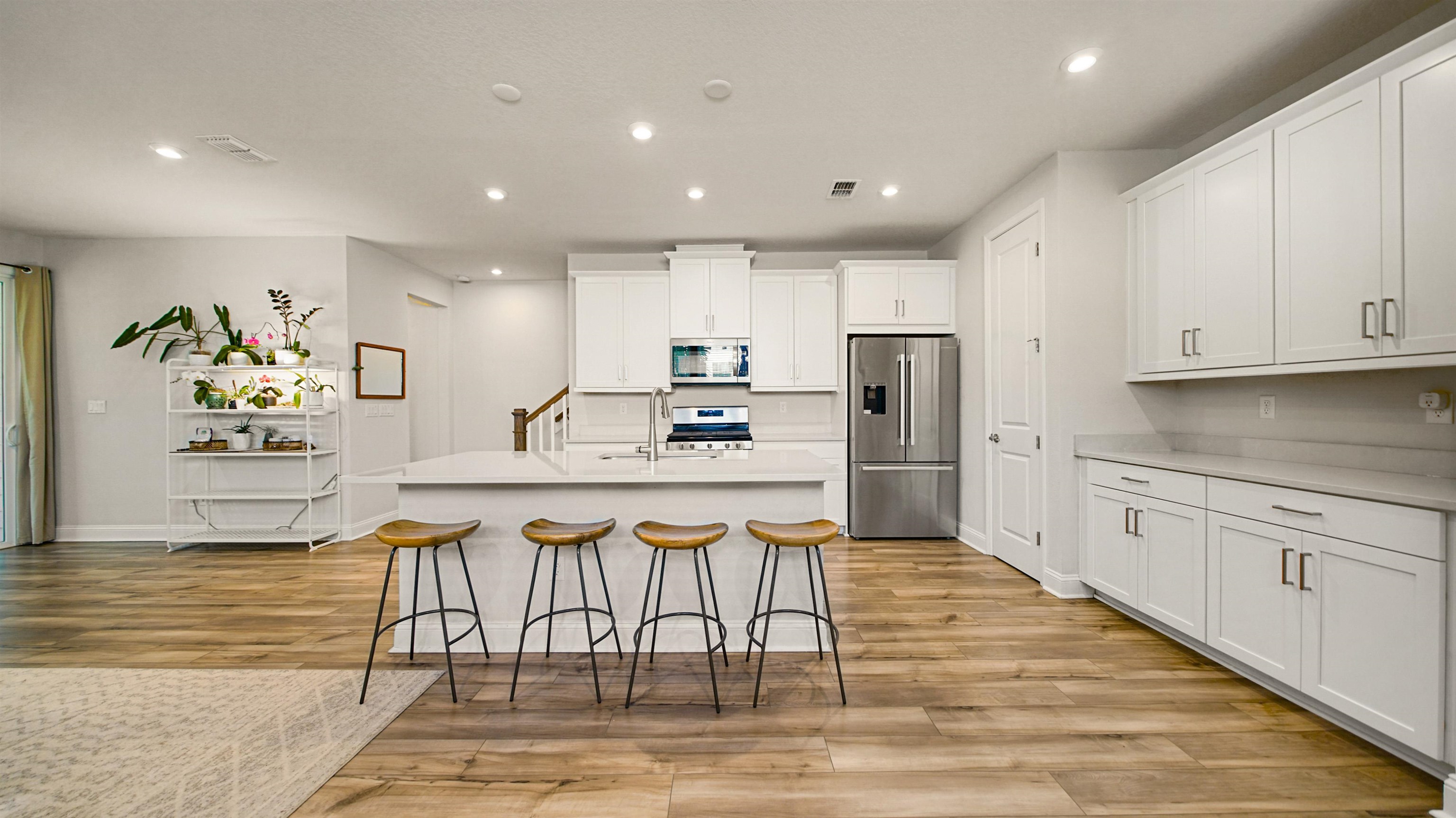 14141 Backbarrier Road Jacksonville, FL 32224 - Photo 4 of 45 a kitchen with stainless steel appliances granite countertop a refrigerator and a stove top oven