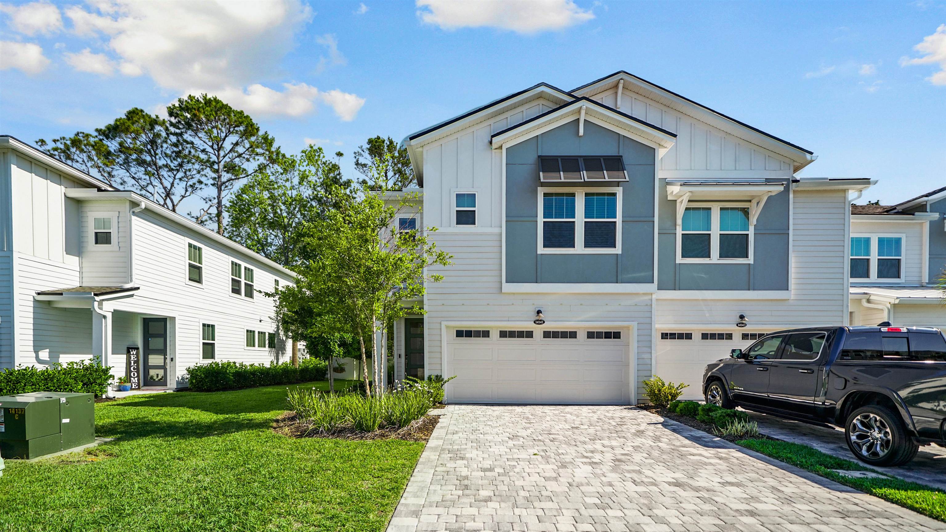 14141 Backbarrier Road Jacksonville, FL 32224 - Photo 42 of 45 a front view of a house with a garden