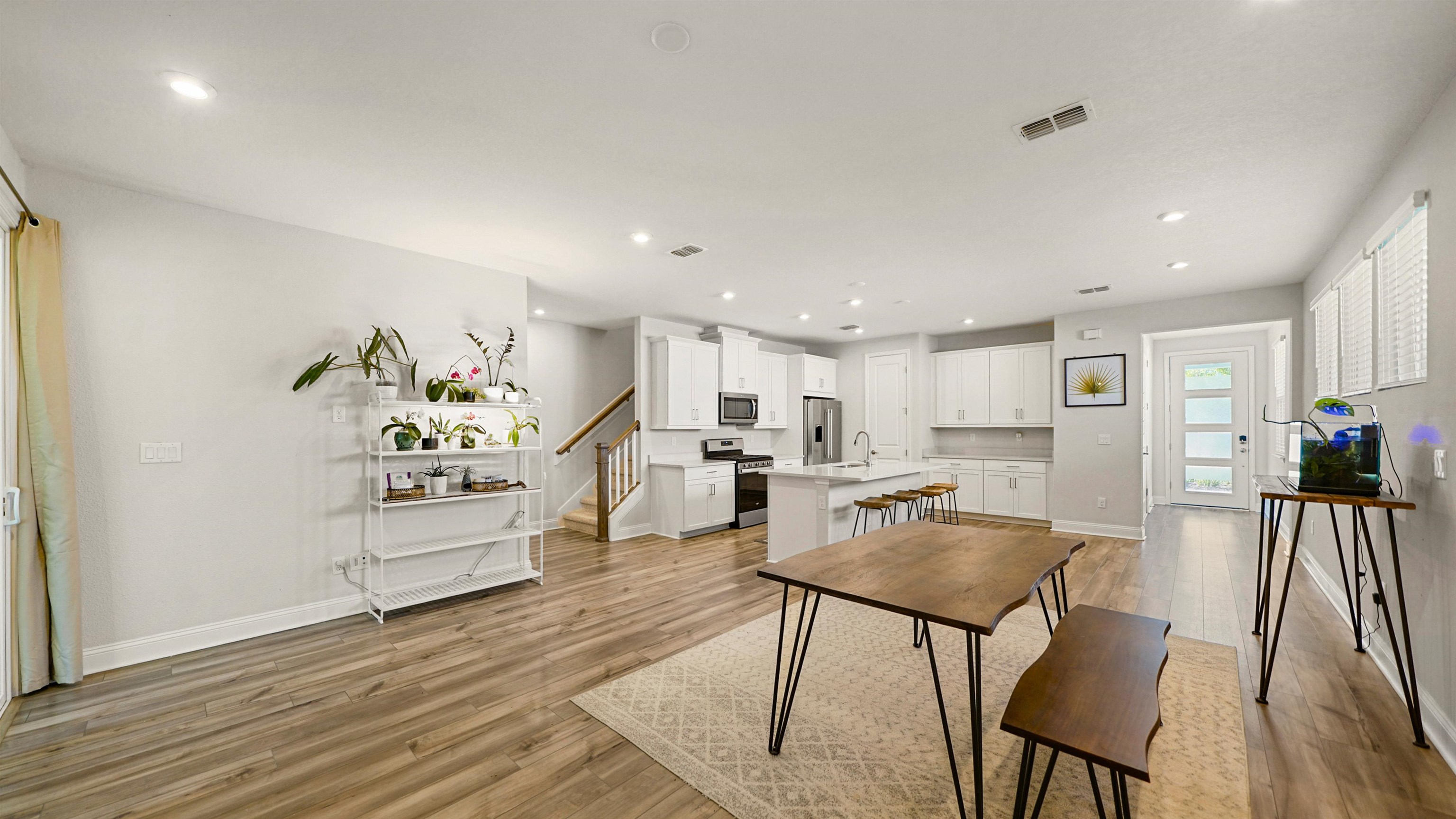 14141 Backbarrier Road Jacksonville, FL 32224 - Photo 5 of 45 a living room with furniture and kitchen view