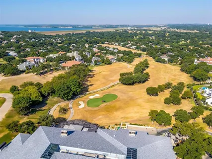 an aerial view of residential houses with outdoor space and river