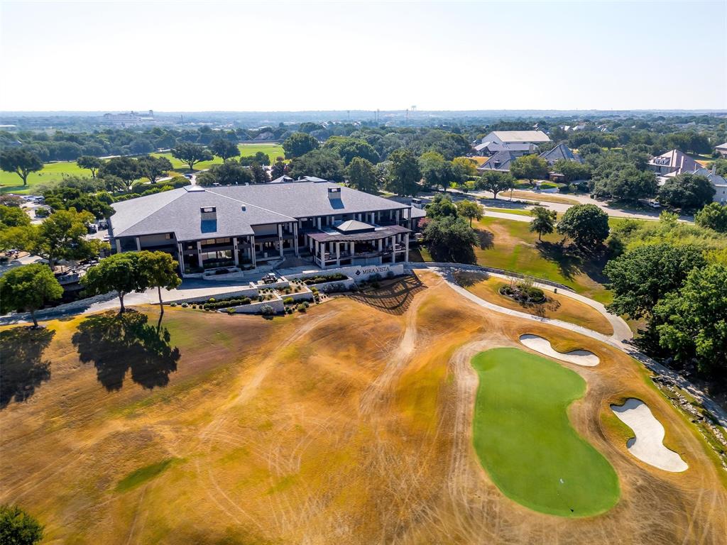 6513 Haig Point Court Fort Worth, TX 76132 - Photo 33 of 37 a view of a swimming pool in front of residential houses
