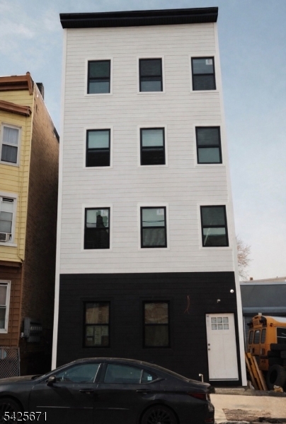 142 Mill Street Paterson, NJ 07501 - Photo 1 of 4 a view of a building with a window