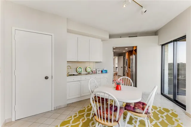 a spacious bathroom with a shower and a sink