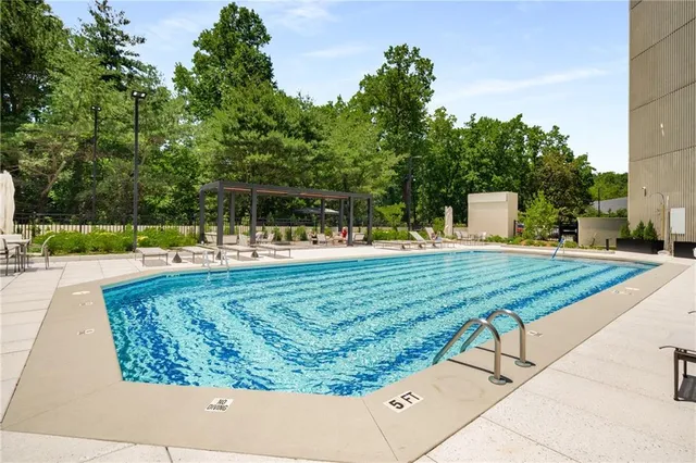 a view of porch with a black white door
