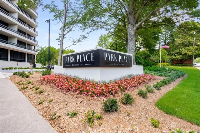 a living room with furniture and large windows