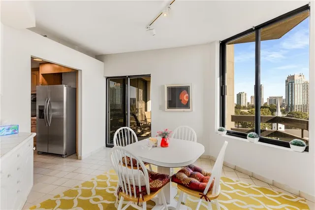 a bathroom with a sink vanity mirror and shower