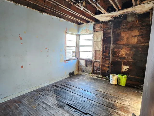 a view of an empty room with a window
