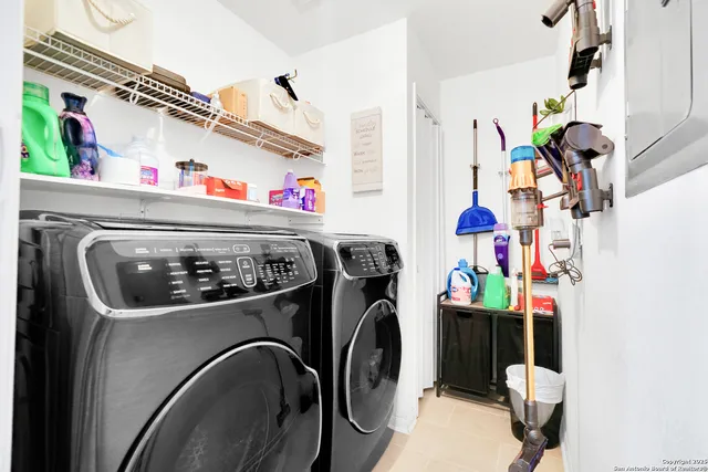 a utility room with dryer and washer