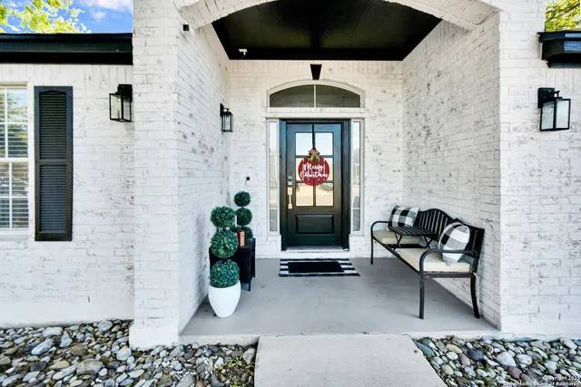 a front view of a house with seating space