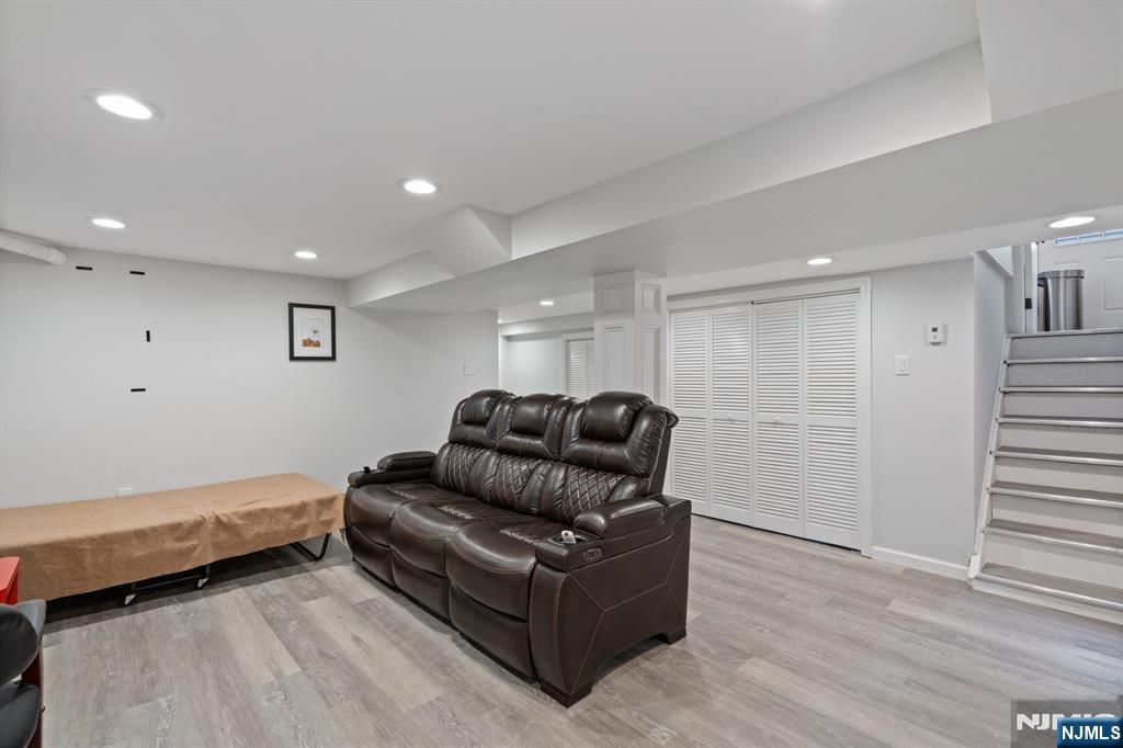 74 Kipp Avenue Hasbrouck Heights, NJ 07604 - Photo 26 of 28 a living room with furniture and wooden floor