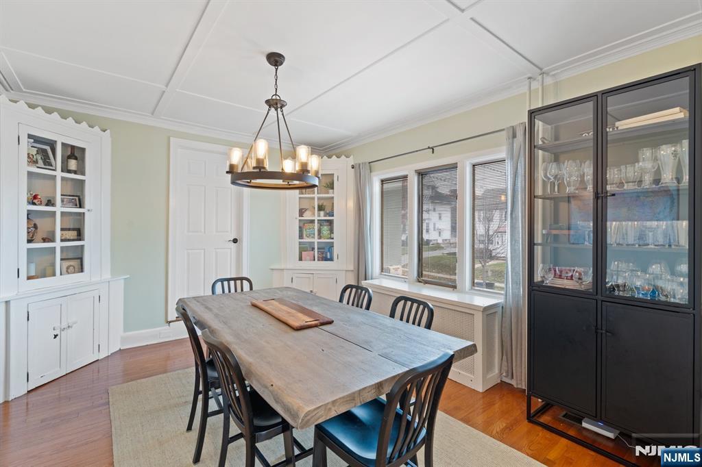 74 Kipp Avenue Hasbrouck Heights, NJ 07604 - Photo 6 of 28 a view of a dining room with furniture large windows and wooden floor