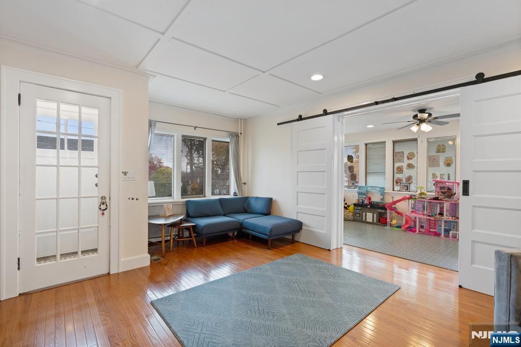 74 Kipp Avenue Hasbrouck Heights, NJ 07604 - Photo 9 of 28 a living room with furniture and wooden floor