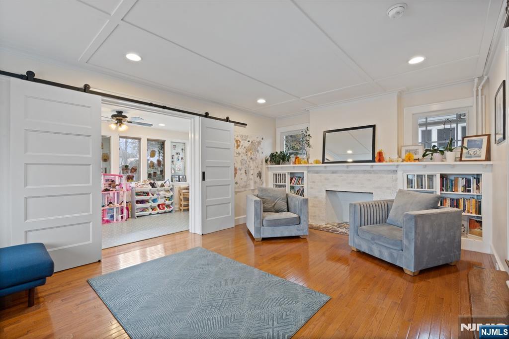 74 Kipp Avenue Hasbrouck Heights, NJ 07604 - Photo 10 of 28 a living room with furniture and a wooden floor