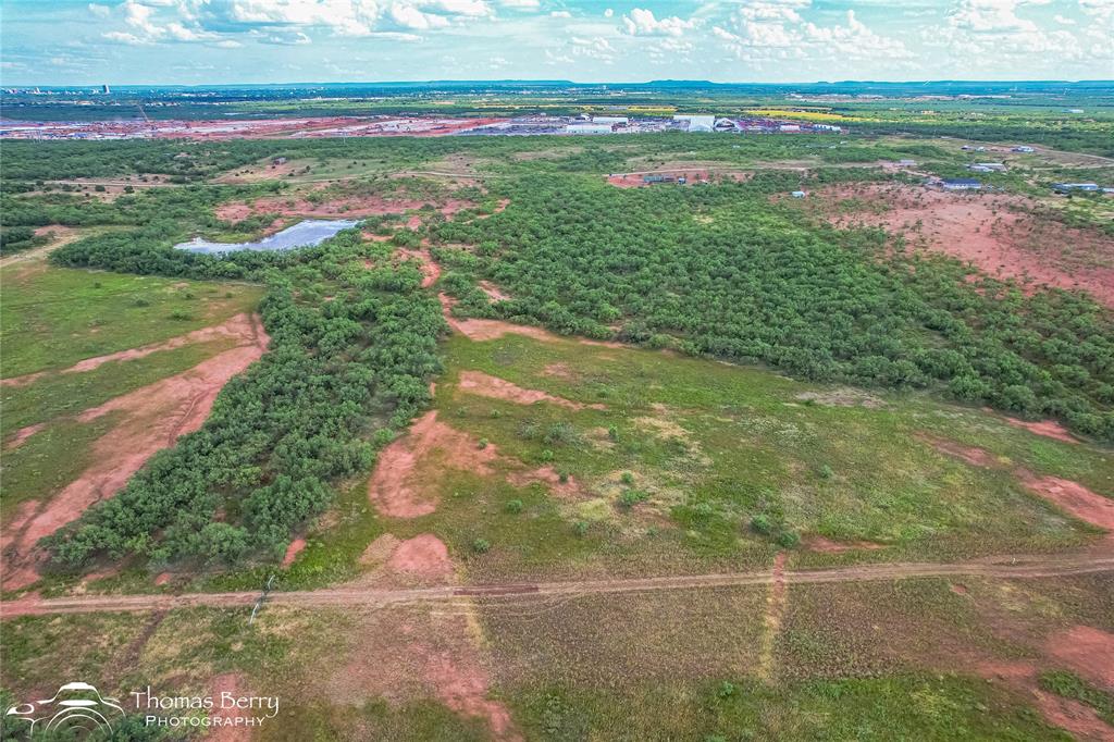 310 Meadow Valley Road Abilene, TX 79601 - Photo 6 of 6 a view of a field with large trees