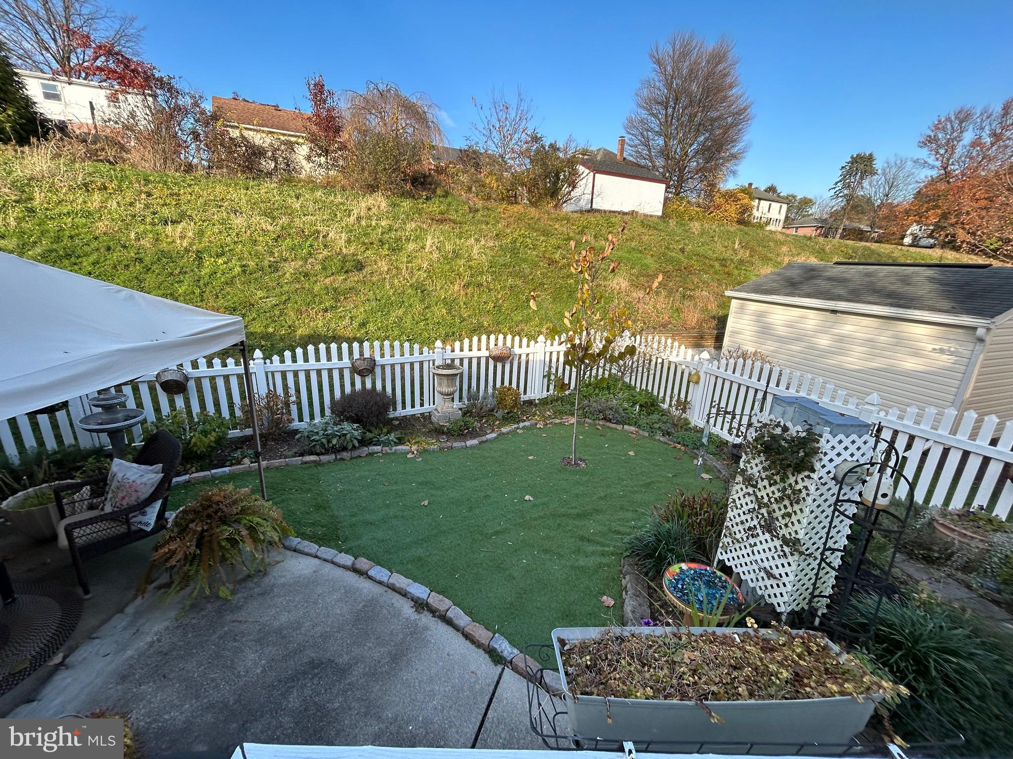 386 West Cedar Street Palmyra, PA 17078 - Photo 37 of 52 Fenced in yard beautifully landscaped & Astro Turf