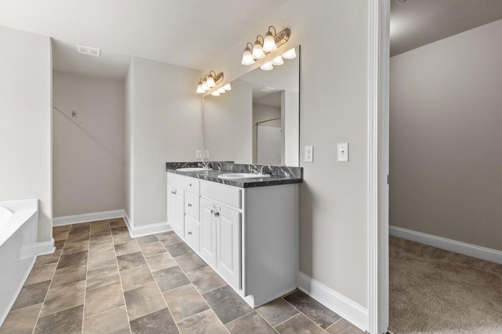 320 Lokeys Lane Bethlehem, GA 30620 - Photo 23 of 44 a view of kitchen with granite countertop cabinets and chandelier