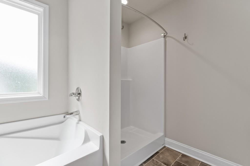320 Lokeys Lane Bethlehem, GA 30620 - Photo 25 of 44 a bathroom with a bathtub