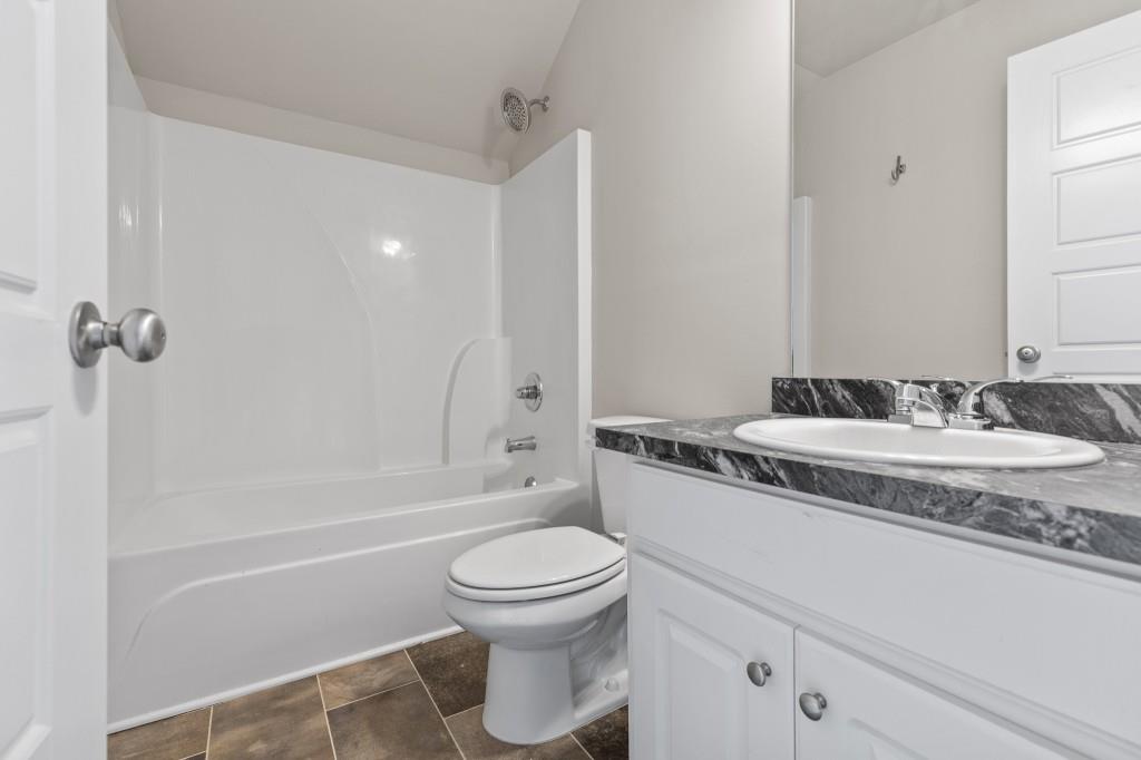 320 Lokeys Lane Bethlehem, GA 30620 - Photo 29 of 44 a bathroom with a granite countertop sink toilet and shower