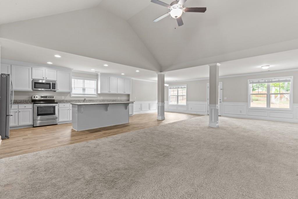 320 Lokeys Lane Bethlehem, GA 30620 - Photo 4 of 44 a view of a kitchen with a sink a ceiling fan and windows