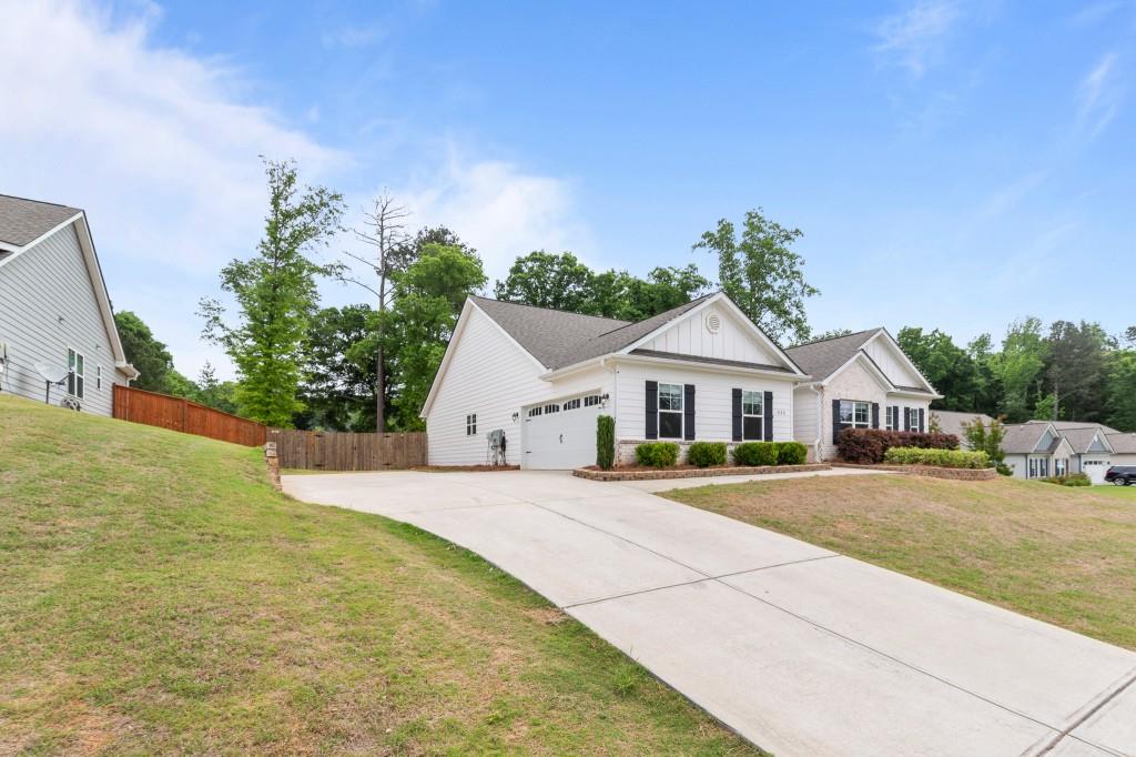 320 Lokeys Lane Bethlehem, GA 30620 - Photo 43 of 44 a view of a house with a yard and potted plants