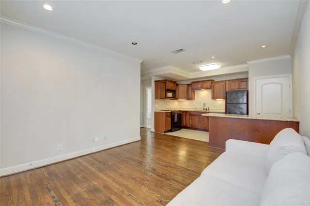 a view of kitchen with kitchen island microwave and stove
