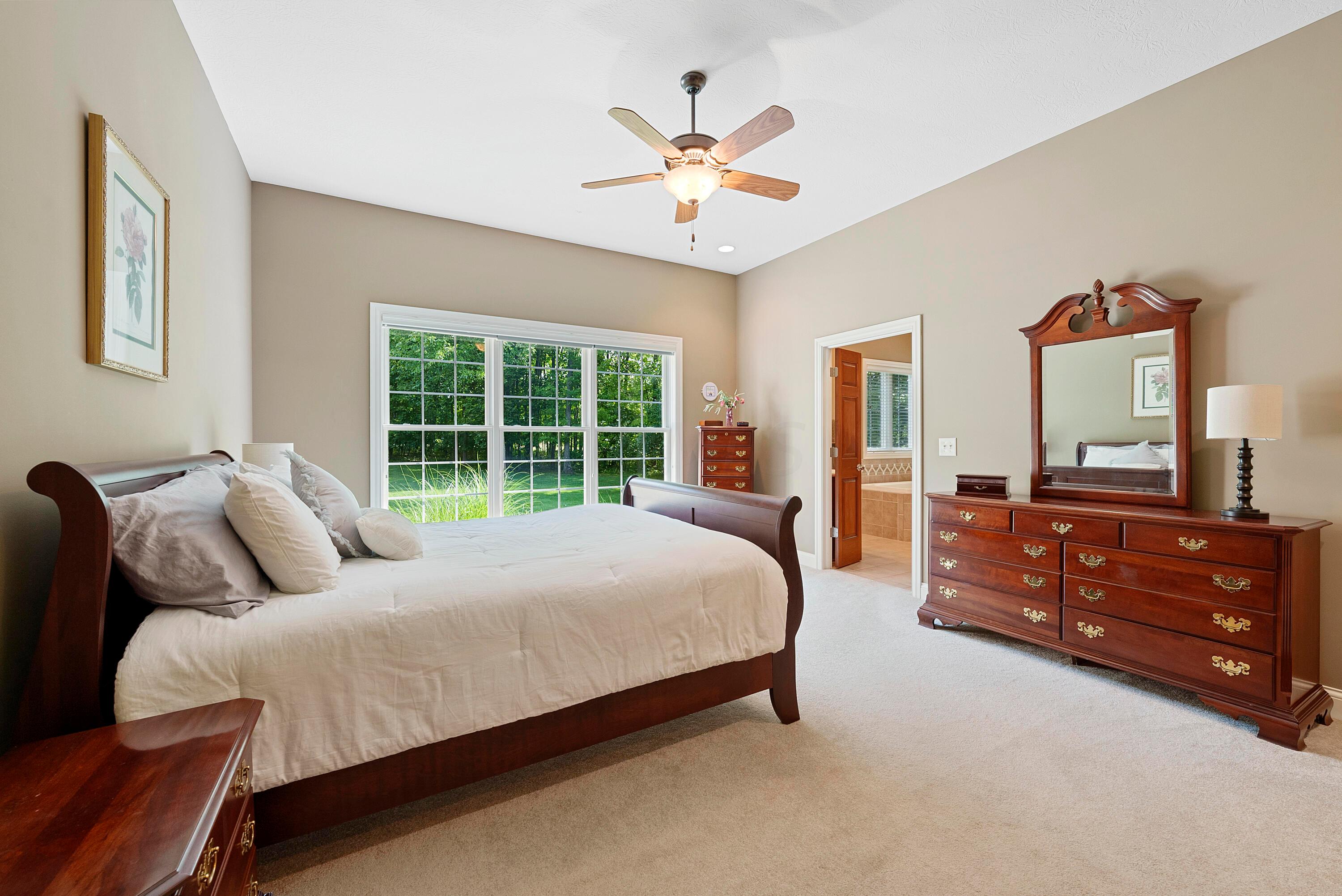 5761 Hughes Road Galena, OH 43021 - Photo 24 of 43 A private sanctuary, relaxing and comfortable, featuring a double door entry, 10’ ceiling with fan/light and recessed lighting, triple windows overlooking the back yard and woods.
