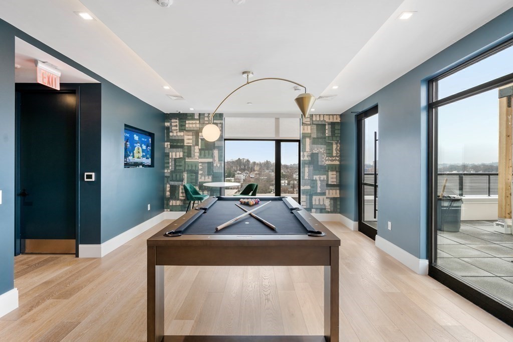 191 Washington Street, Unit 720 Boston, MA 02135 - Photo 18 of 29 a view of living room with furniture and large windows