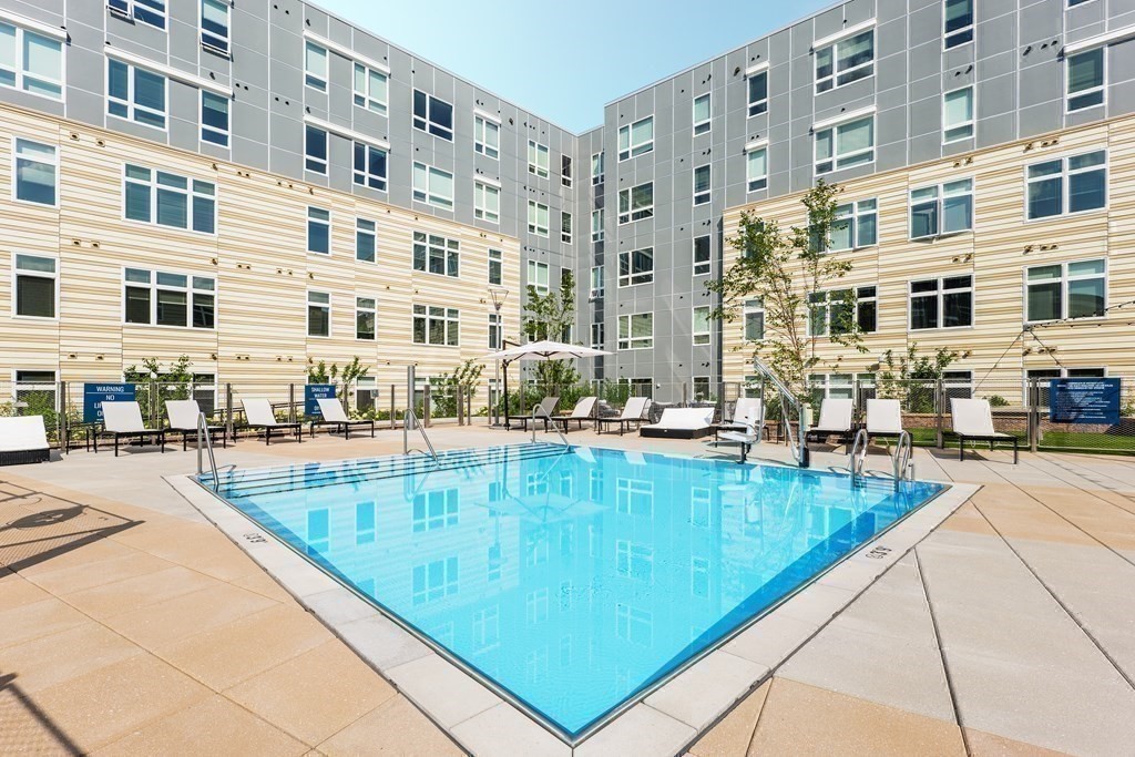 191 Washington Street, Unit 720 Boston, MA 02135 - Photo 28 of 29 a view of swimming pool with outdoor seating