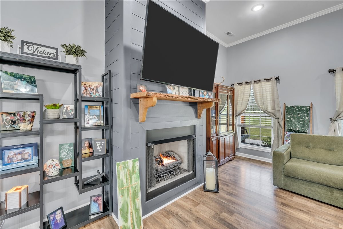 8 Valley Pond Lane Kelso, TN 37348 - Photo 11 of 75 a living room with furniture a flat screen tv and a fireplace