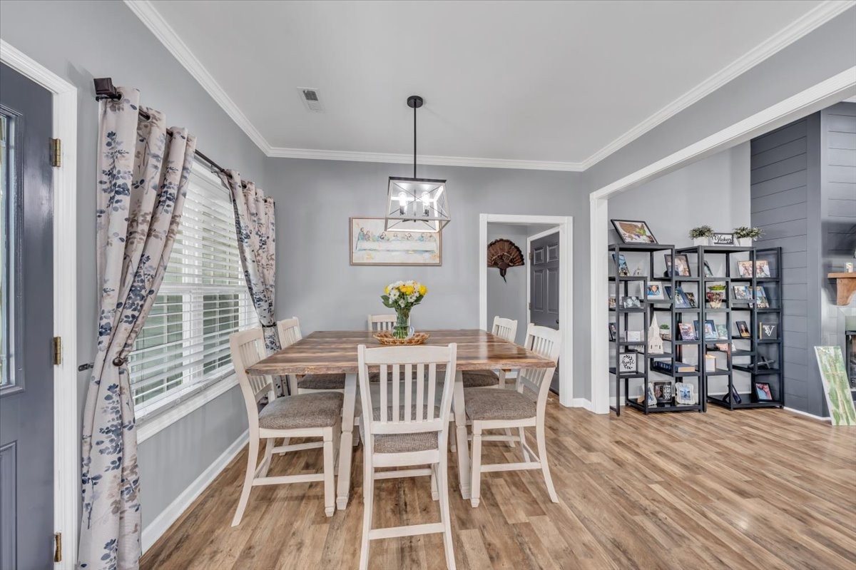 8 Valley Pond Lane Kelso, TN 37348 - Photo 13 of 75 a view of a dining room with furniture window and wooden floor