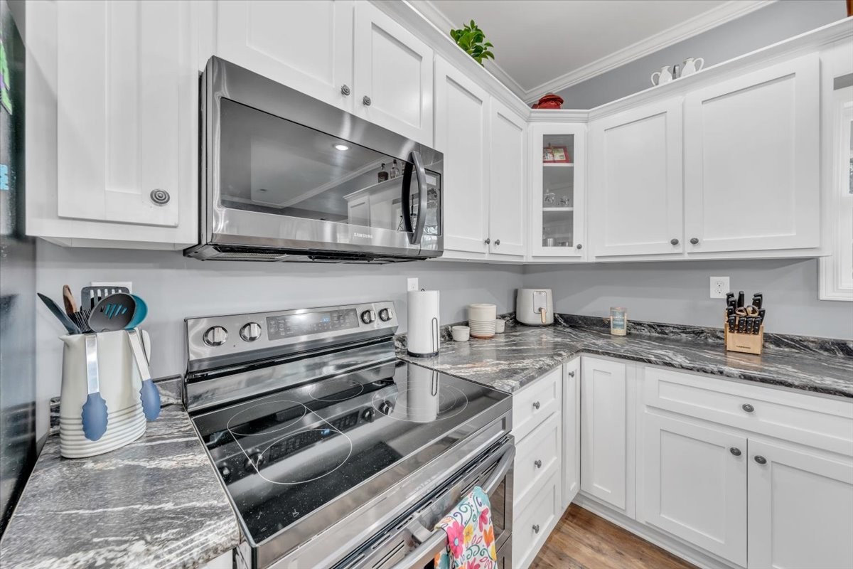8 Valley Pond Lane Kelso, TN 37348 - Photo 20 of 75 a kitchen with stainless steel appliances granite countertop a sink and a stove