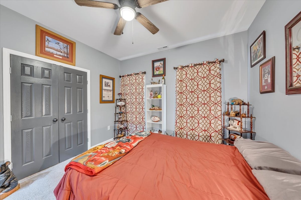 8 Valley Pond Lane Kelso, TN 37348 - Photo 25 of 75 a bedroom with a large bed and a chandelier