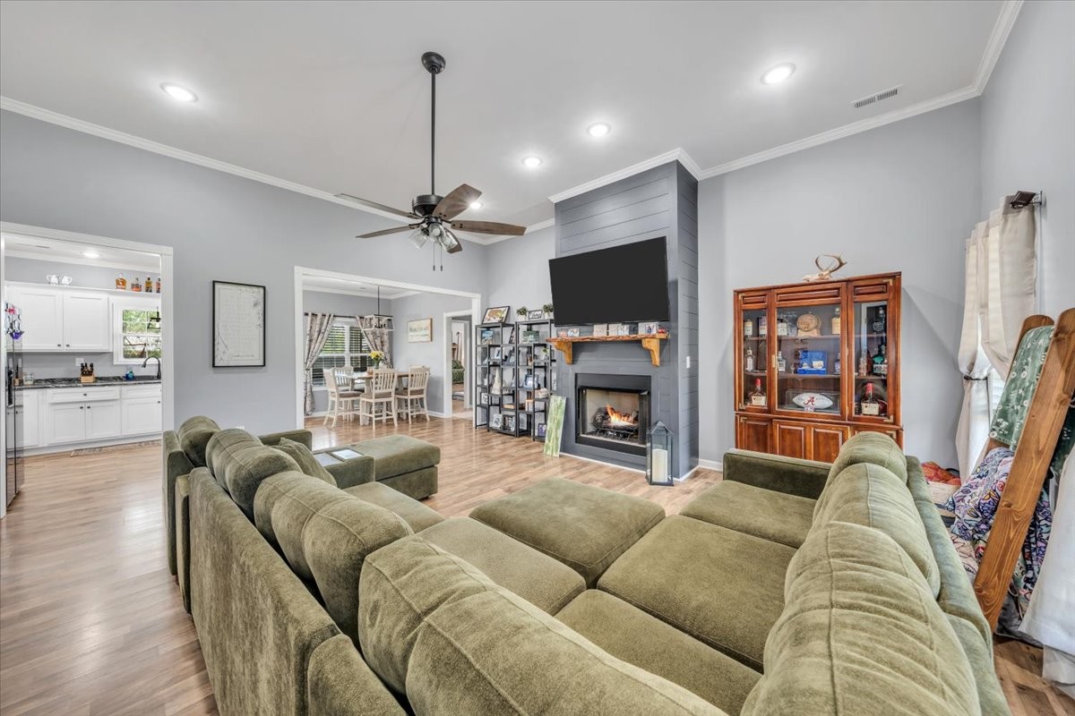 8 Valley Pond Lane Kelso, TN 37348 - Photo 7 of 75 a living room with furniture a flat screen tv and a fireplace