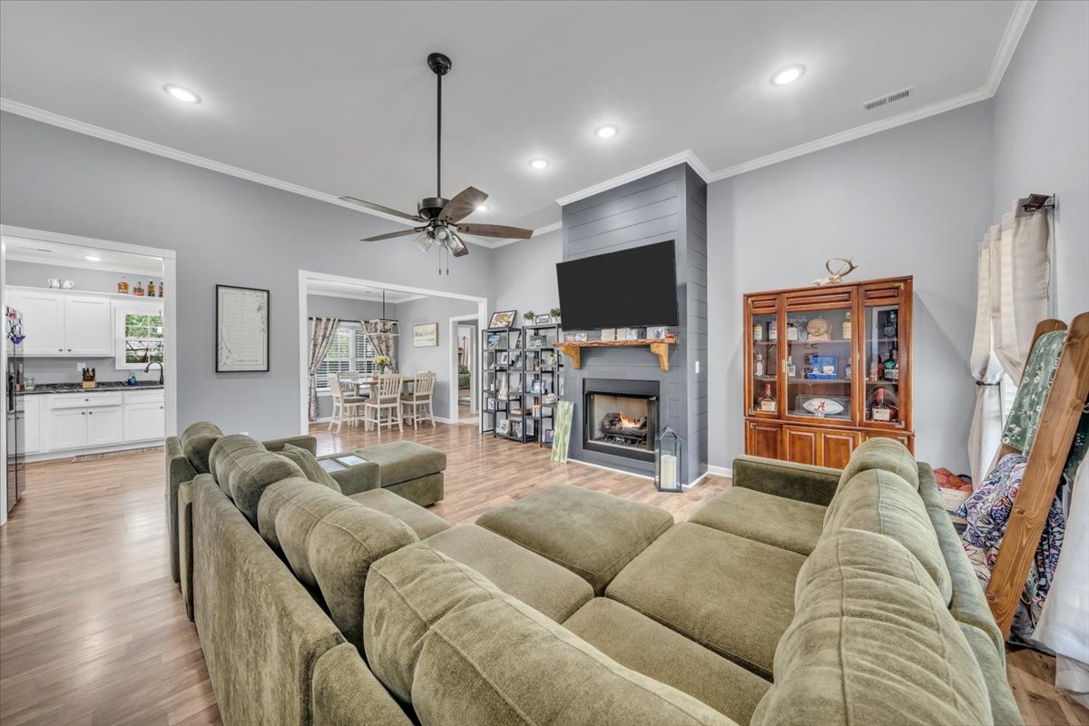 8 Valley Pond Lane Kelso, TN 37348 - Photo 8 of 75 a living room with furniture a flat screen tv and a fireplace