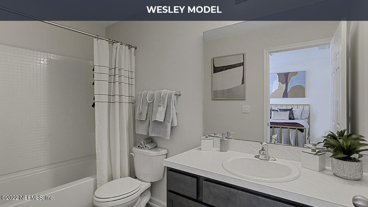 123 Java Lane St. Augustine, FL 32092 - Photo 13 of 30 a bathroom with a sink toilet and shower