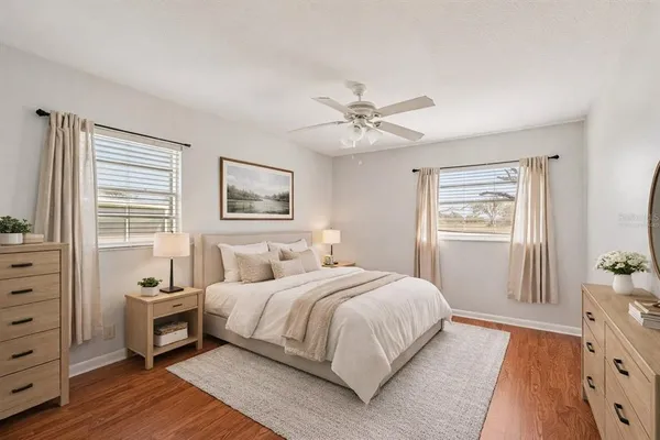 a bedroom with a large bed and a tv