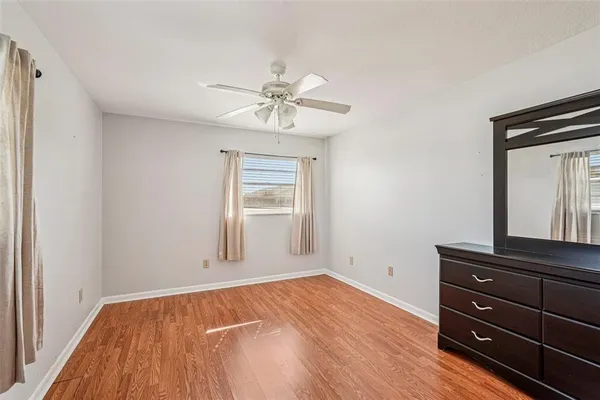 a view of room with window and ceiling fan