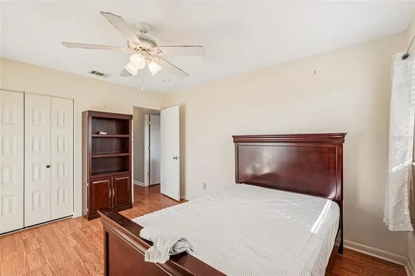 a bedroom with a bed and a dresser