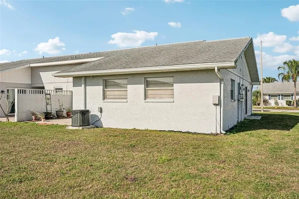 a view of a house with basketball court