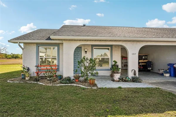 a view of a house with outdoor seating space