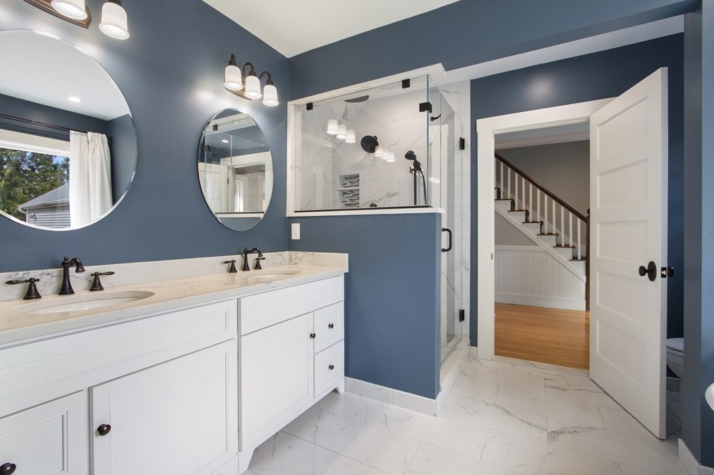 97 Argilla Road Andover, MA 01810 - Photo 19 of 42 a en suite bathroom with a double vanity sink and a mirror