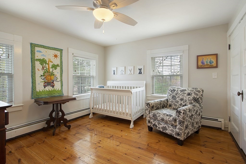 97 Argilla Road Andover, MA 01810 - Photo 22 of 42 a bedroom with a bed and a window
