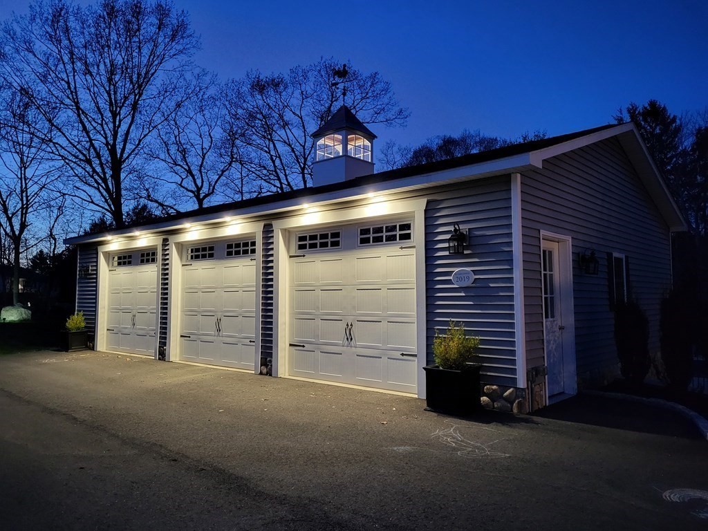 97 Argilla Road Andover, MA 01810 - Photo 31 of 42 a view of an empty room with stairs and a fireplace