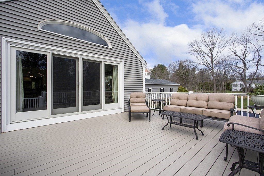 97 Argilla Road Andover, MA 01810 - Photo 34 of 42 a balcony with furniture and wooden floor