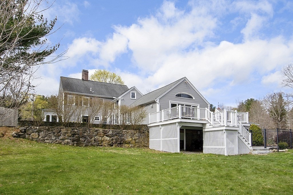 97 Argilla Road Andover, MA 01810 - Photo 37 of 42 a front view of a house with a garden and yard