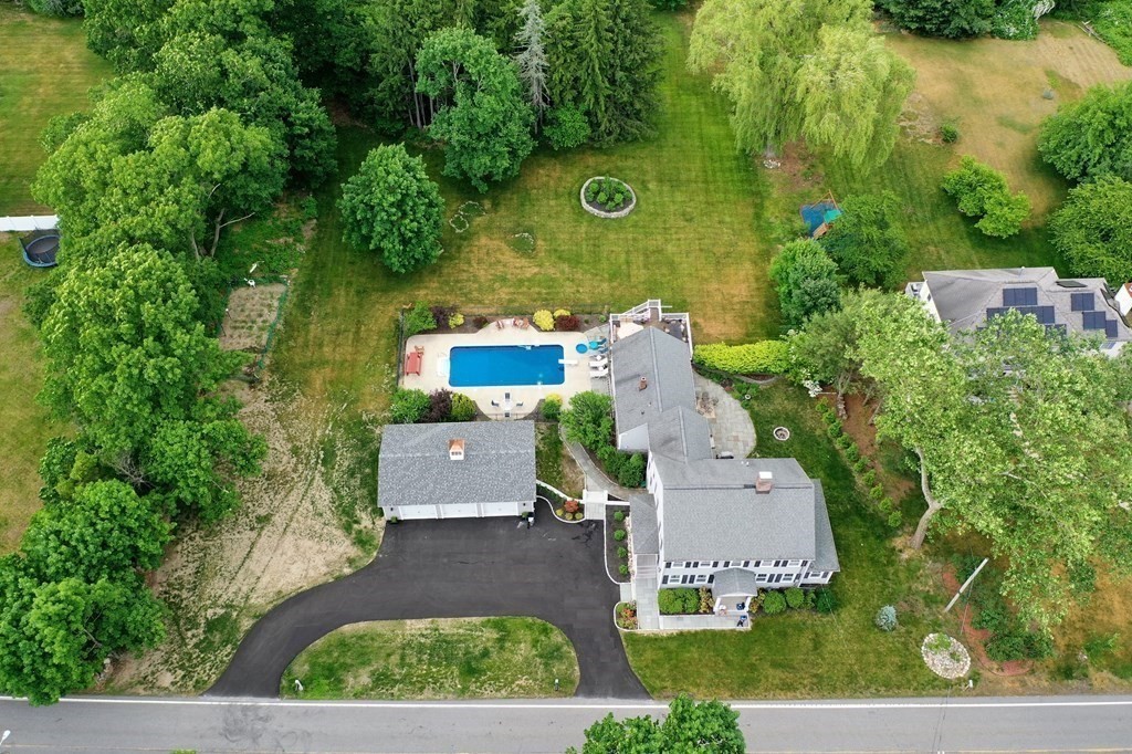 97 Argilla Road Andover, MA 01810 - Photo 40 of 42 an aerial view of a house with a yard and trees