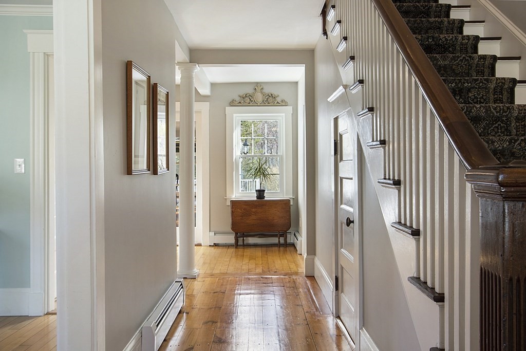 97 Argilla Road Andover, MA 01810 - Photo 4 of 42 a view of a hallway view with wooden floor and staircase