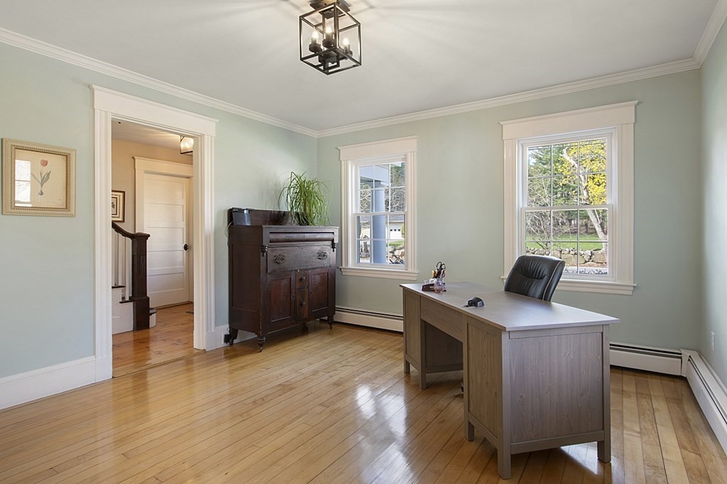 97 Argilla Road Andover, MA 01810 - Photo 6 of 42 a view of a workspace with furniture and a window