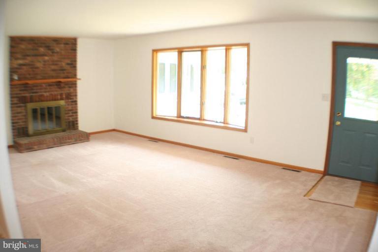 304 Warfieldsburg Road Westminster, MD 21157 - Photo 2 of 19 an empty room with windows