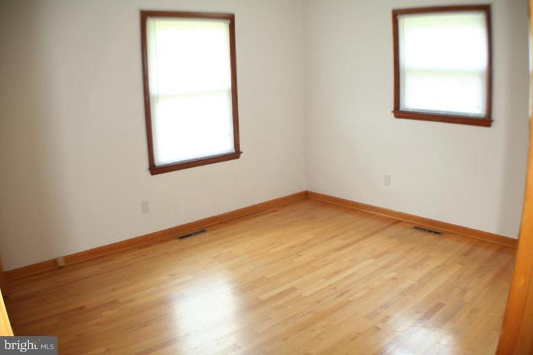 304 Warfieldsburg Road Westminster, MD 21157 - Photo 11 of 19 an empty room with a window